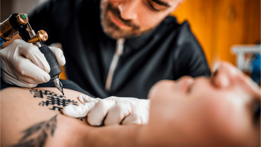 man tattooing permanent tattoo