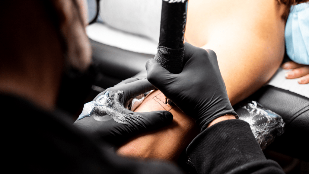 man doing tattoos